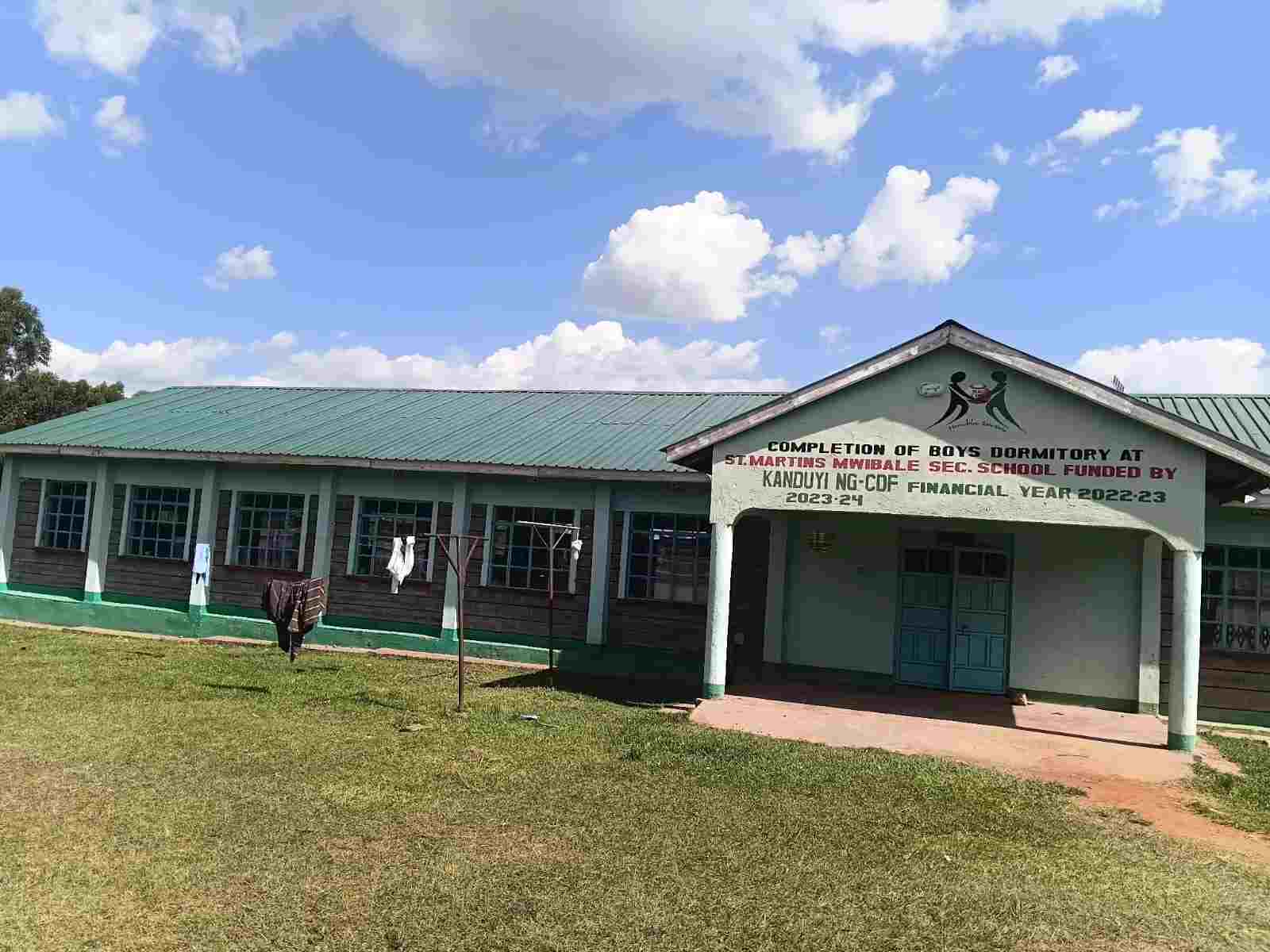Boys dormitory building with completion signage at Mwibale Senior School Bungoma County