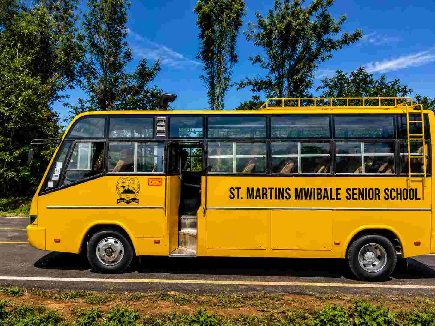 St Martins Mwibale school bus side view, yellow with black branding